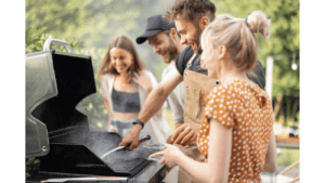 people grilling on a gas grill afternoon barbecue, bbq, lava rocks for gas grills